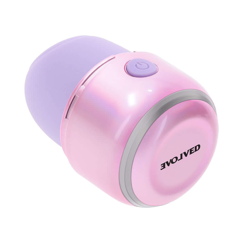 Evolved Vacation Vibes Tapping Massager in pink-pearl iridescent design, compact travel-friendly stimulator.