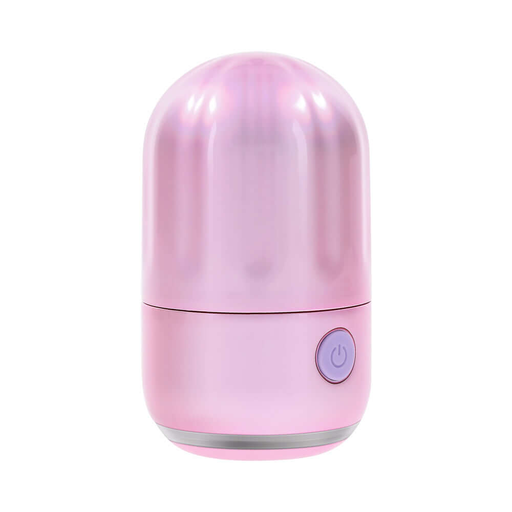 Evolved Vacation Vibes Tapping Massager in a pink-pearl iridescent design, compact and discreet for travel.