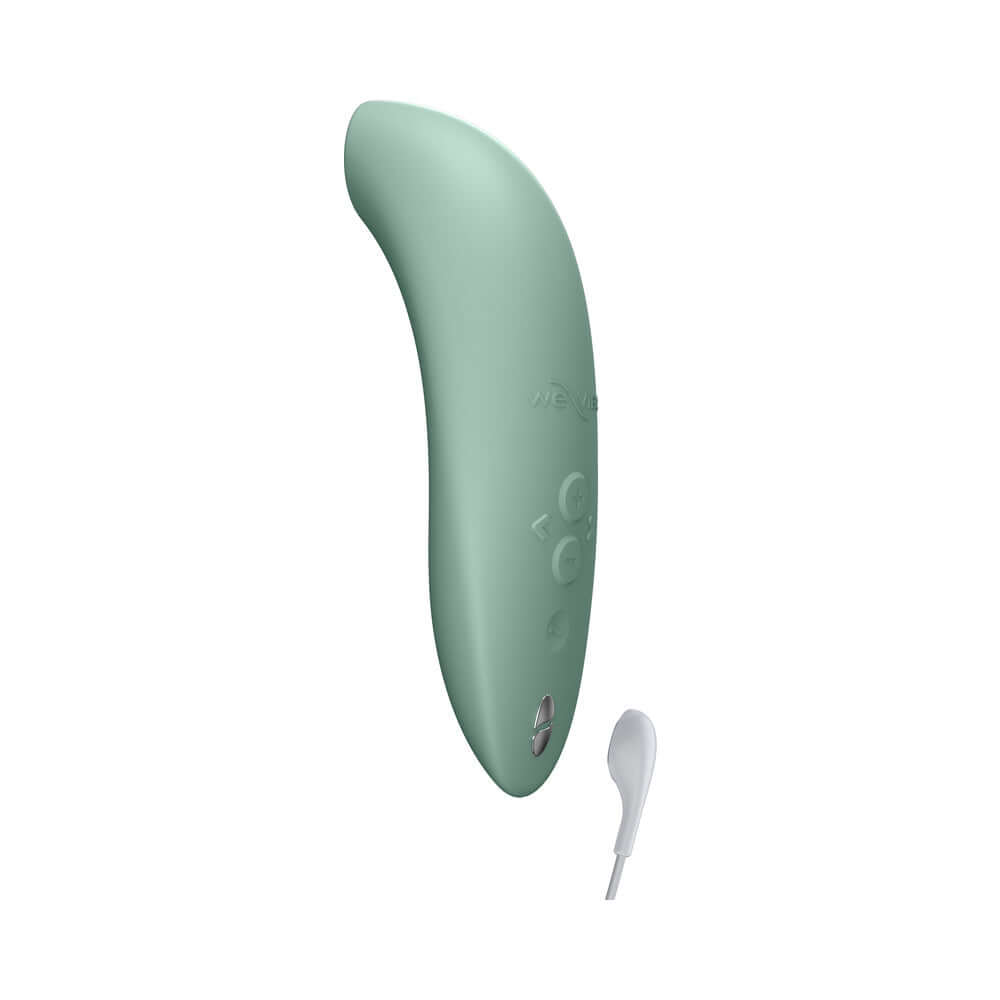 We-Vibe Melt 2 Pleasure Air Clitoral Stimulator Sage in sage green color with charging cord.