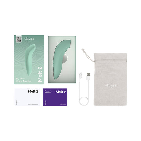 We-Vibe Melt 2 Pleasure Air Clitoral Stimulator Sage packaging and accessories laid out.