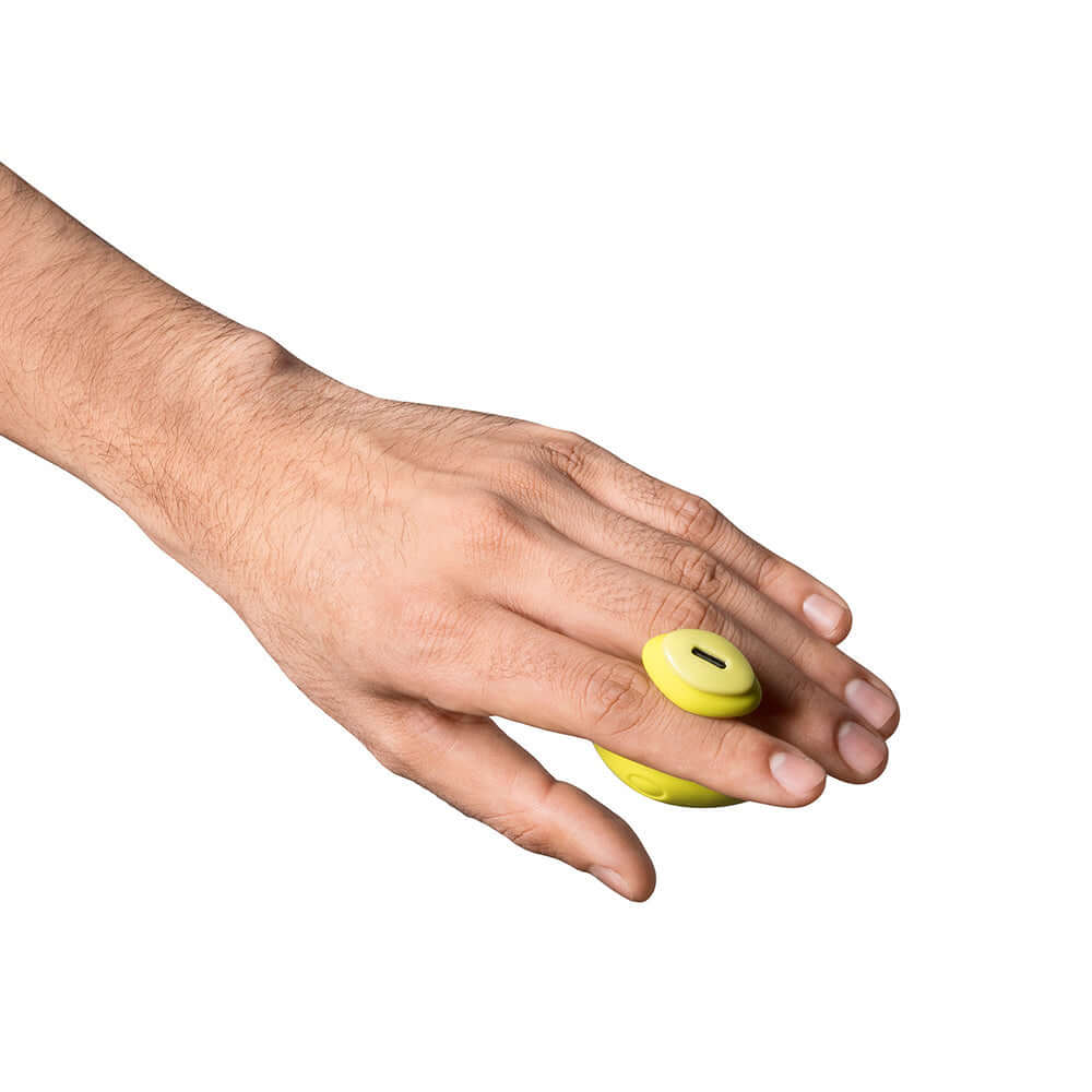 Dame Fin 2.0 Finger Vibrator Citrus comfortably worn on a finger, enhancing natural touch with smooth vibrations.