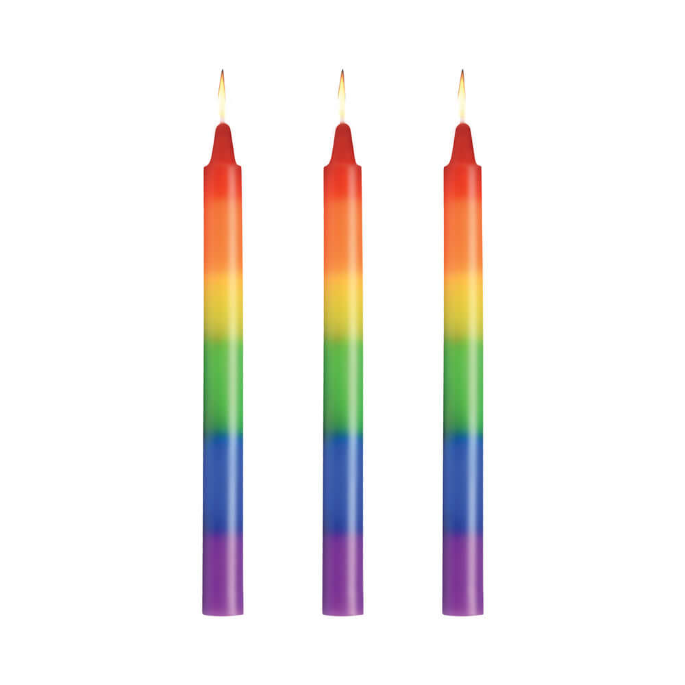 Master Series Pride Candles Rainbow Drip Candle Set of 3 featuring vibrant rainbow colors and lit wicks.
