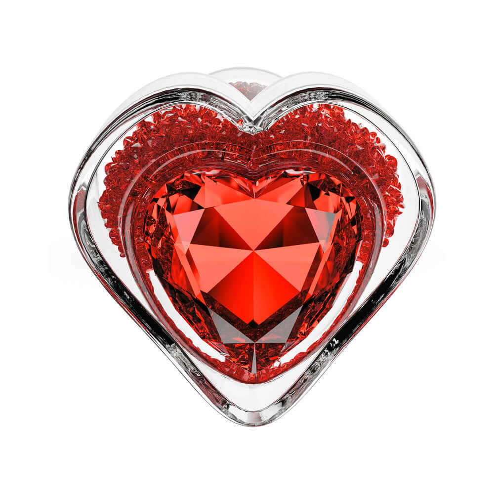 Oh My Gem Lustre Glass Anal Plug Red with a heart-shaped design showcasing its fiery ruby-inspired color.