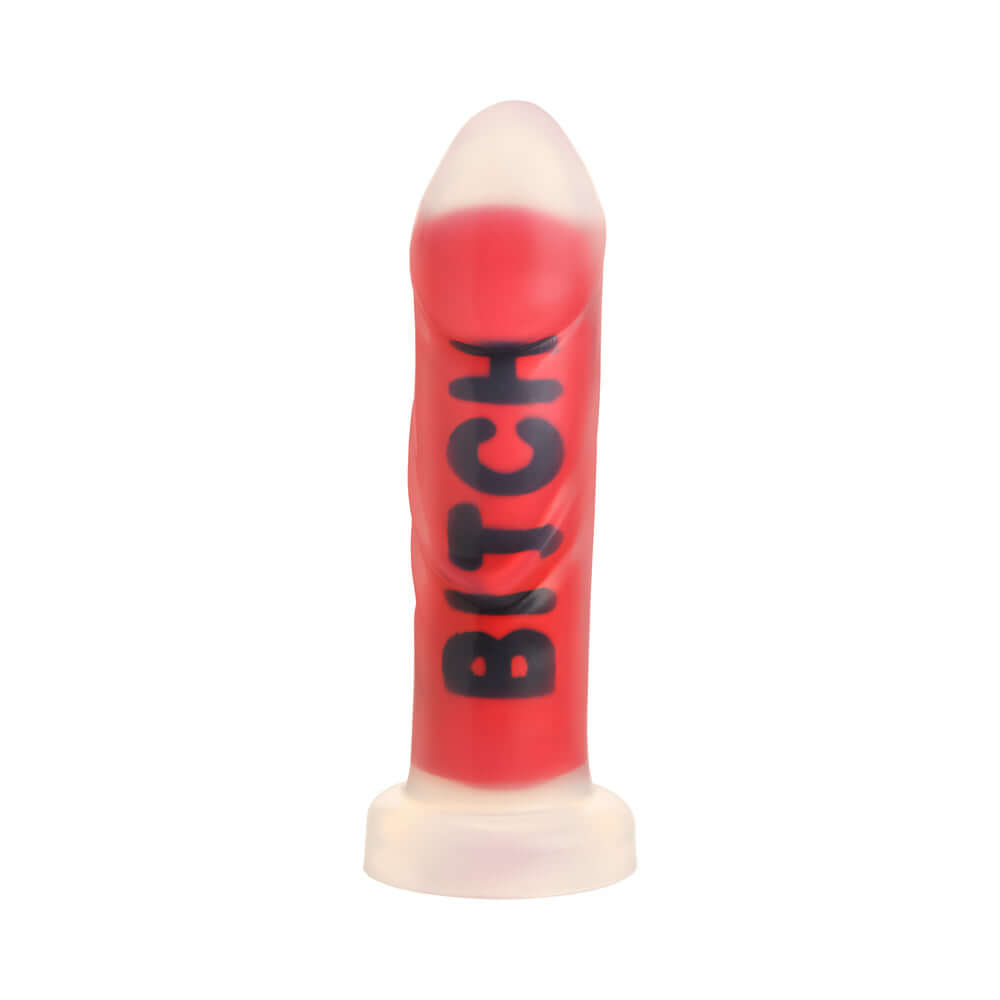 Master Series BITCH Silicone Dildo in vibrant red with bold lettering, designed for intense pleasure and fantasy fulfillment.