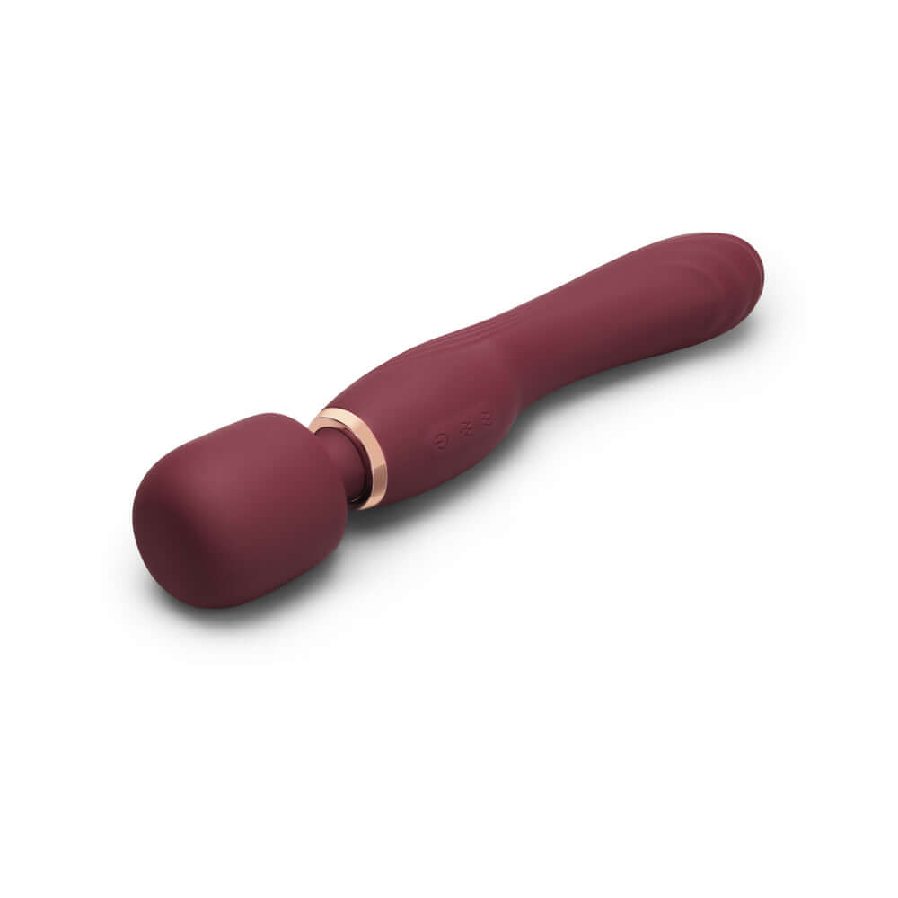 Le Wand Flat Top Fusion G Double-Ended Petite Wand Vibrator in a burgundy color with a rounded tip.