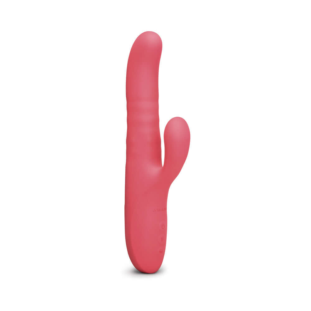 Le Wand Thrust Rabbit Vibrator in vibrant pink for dual stimulation and pleasure.