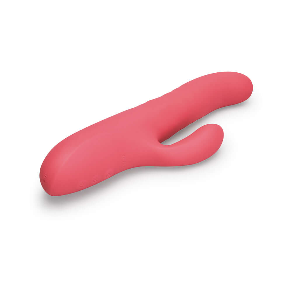 Le Wand Thrust Rabbit Vibrator in soft pink silicone for dual stimulation and intimate pleasure.