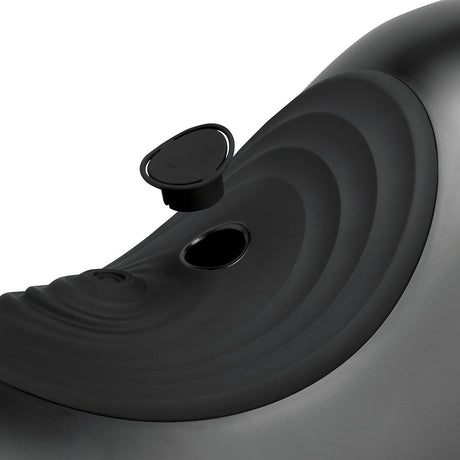 Close-up of The Cowgirl Saddle Machine Black, showcasing the sleek black design and unique contours.