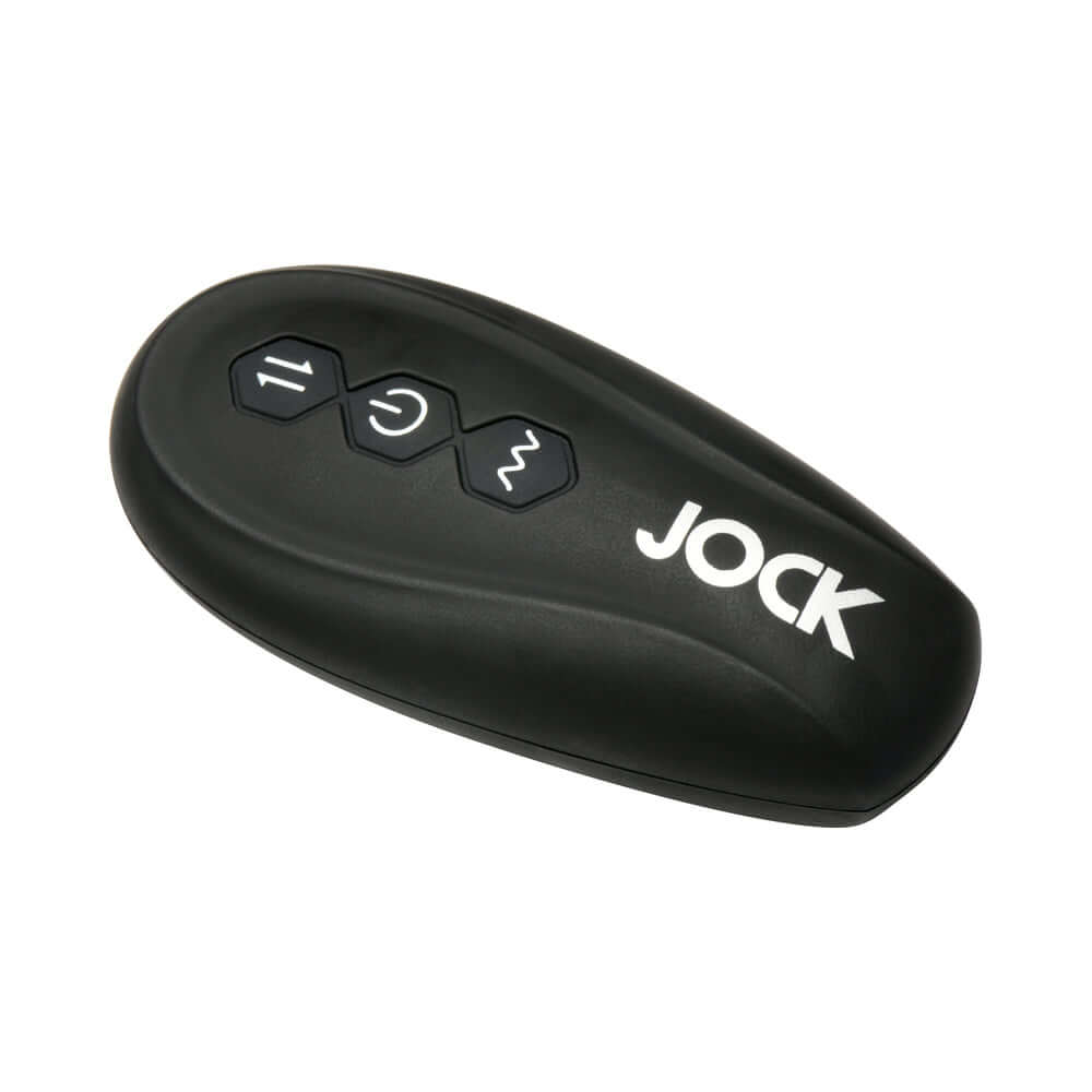 JOCK Silicone Vibrating Anal Plug with Cock and Ball Ring remote control with buttons for intensity and modes.