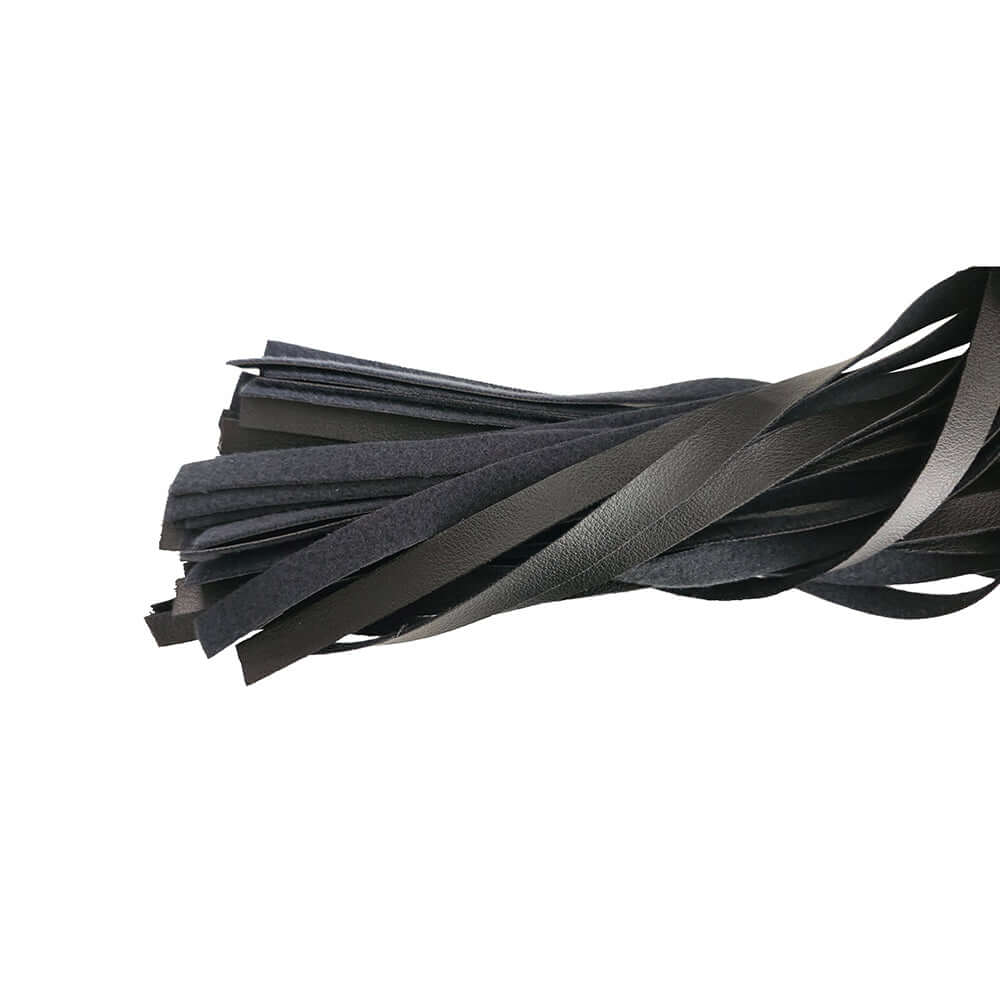 Detail of tails from the Rouge Fetish Play Vegan Wooden Handle Flogger Black showcasing soft faux leather design.