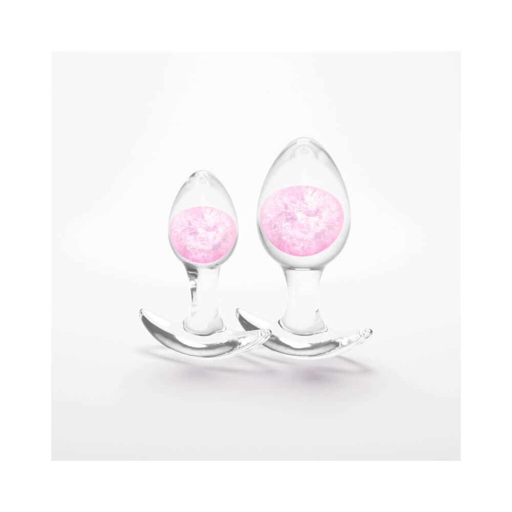Cosmic Glams Silicone Anal Plug Kit 2pc Set Pink featuring two elegant, clear silicone plugs with pink accents.