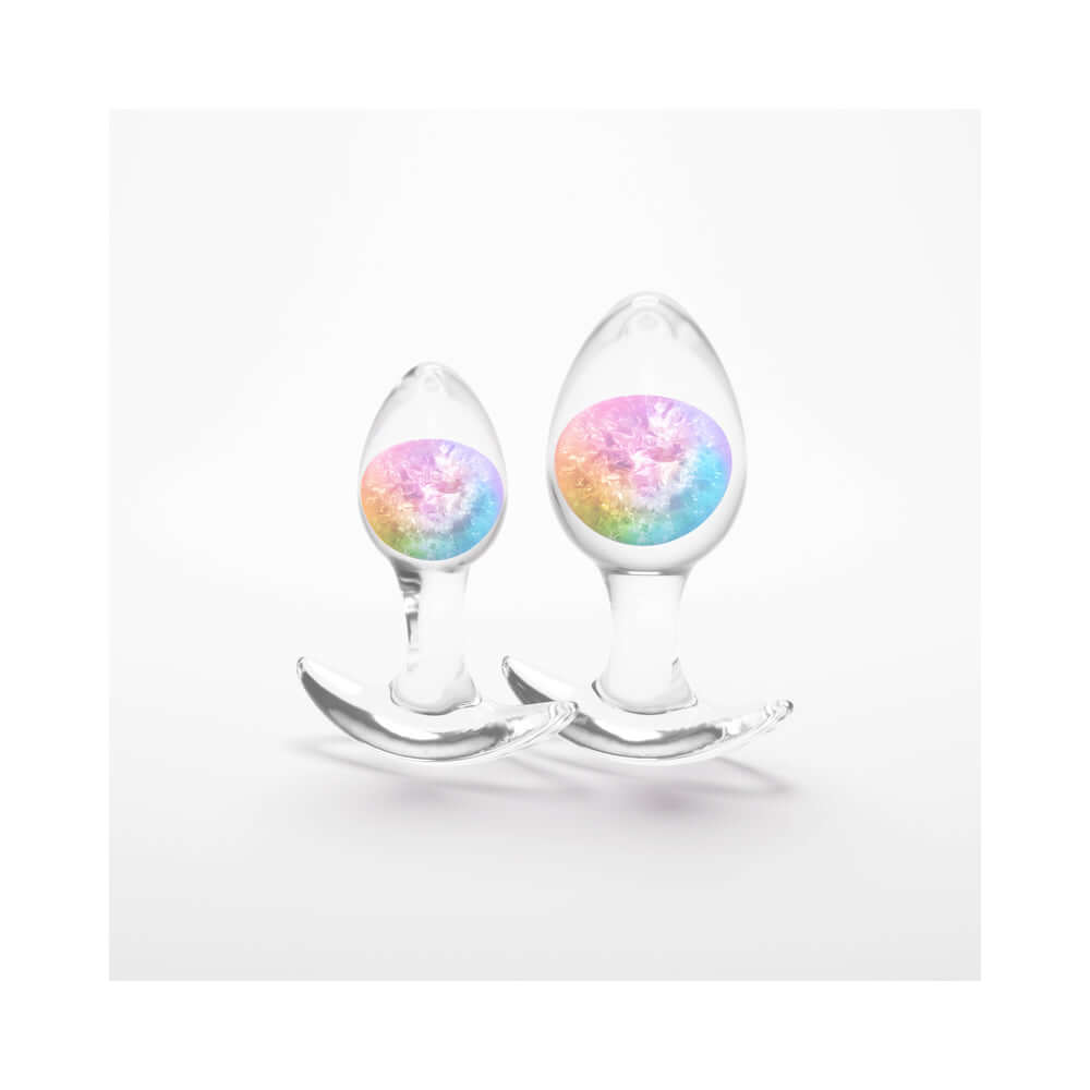 Cosmic Glams Silicone Anal Plug Kit 2pc Set Rainbow featuring two colorful silicone anal plugs.