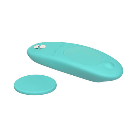 We-Vibe Moxie Plus Wearable Clitoral Vibrator Teal with magnetic clip and remote, designed for discreet pleasure.