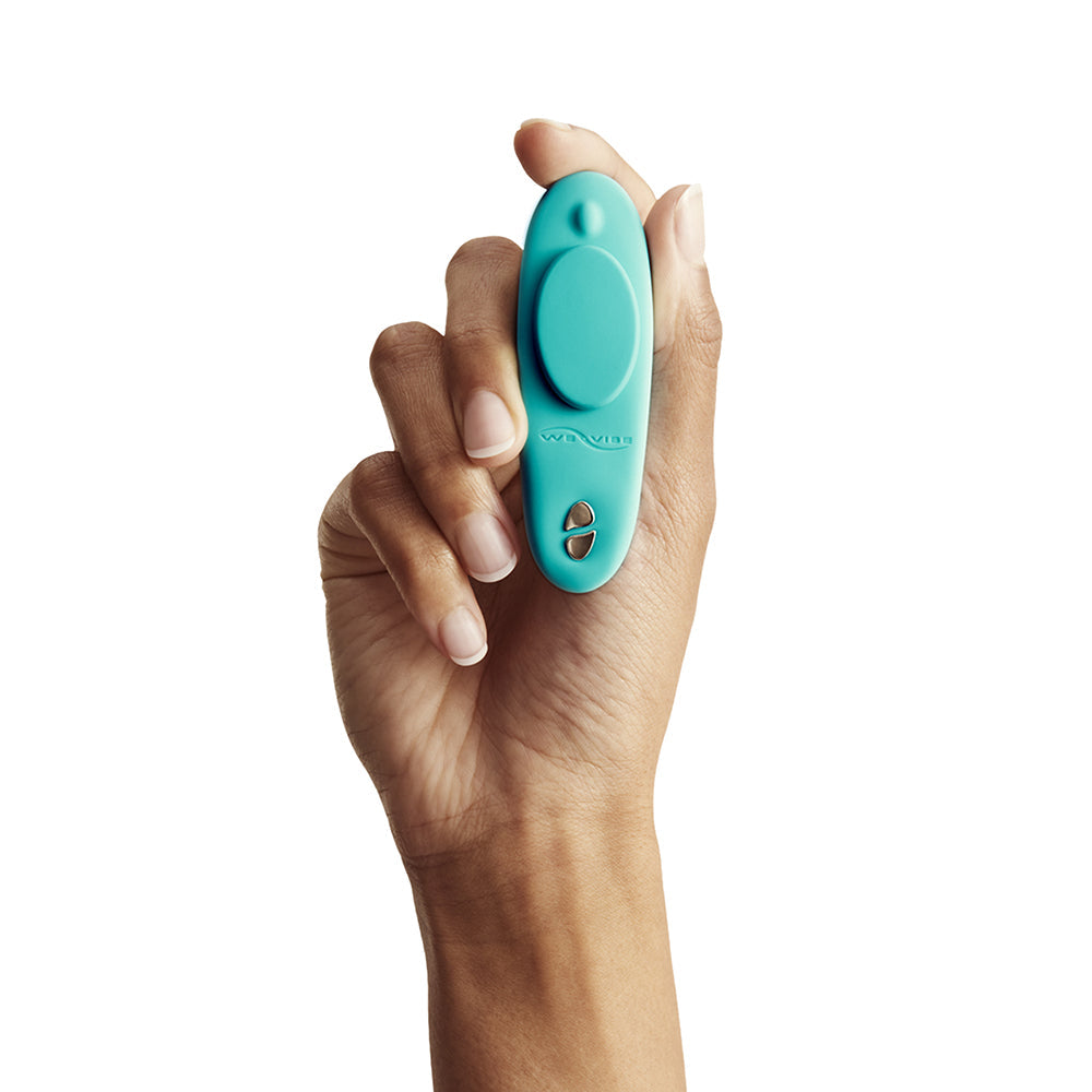 We-Vibe Moxie Plus Wearable Clitoral Vibrator Teal held in a hand for discreet pleasure anywhere.