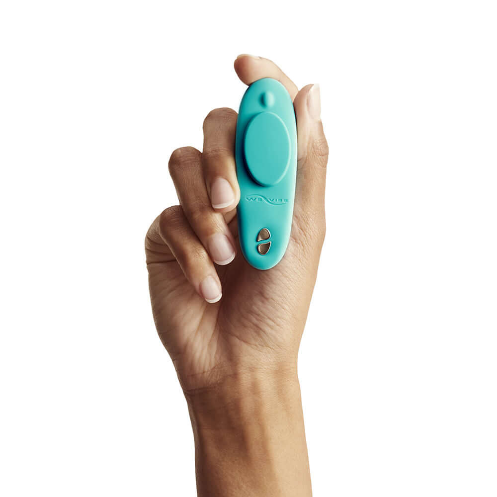 We-Vibe Moxie Plus Wearable Clitoral Vibrator Teal held in a hand for discreet pleasure anywhere.