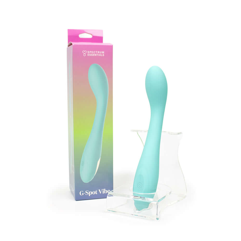 Spectrum Essentials Silicone G-spot Vibrator Blue in packaging on display stand.