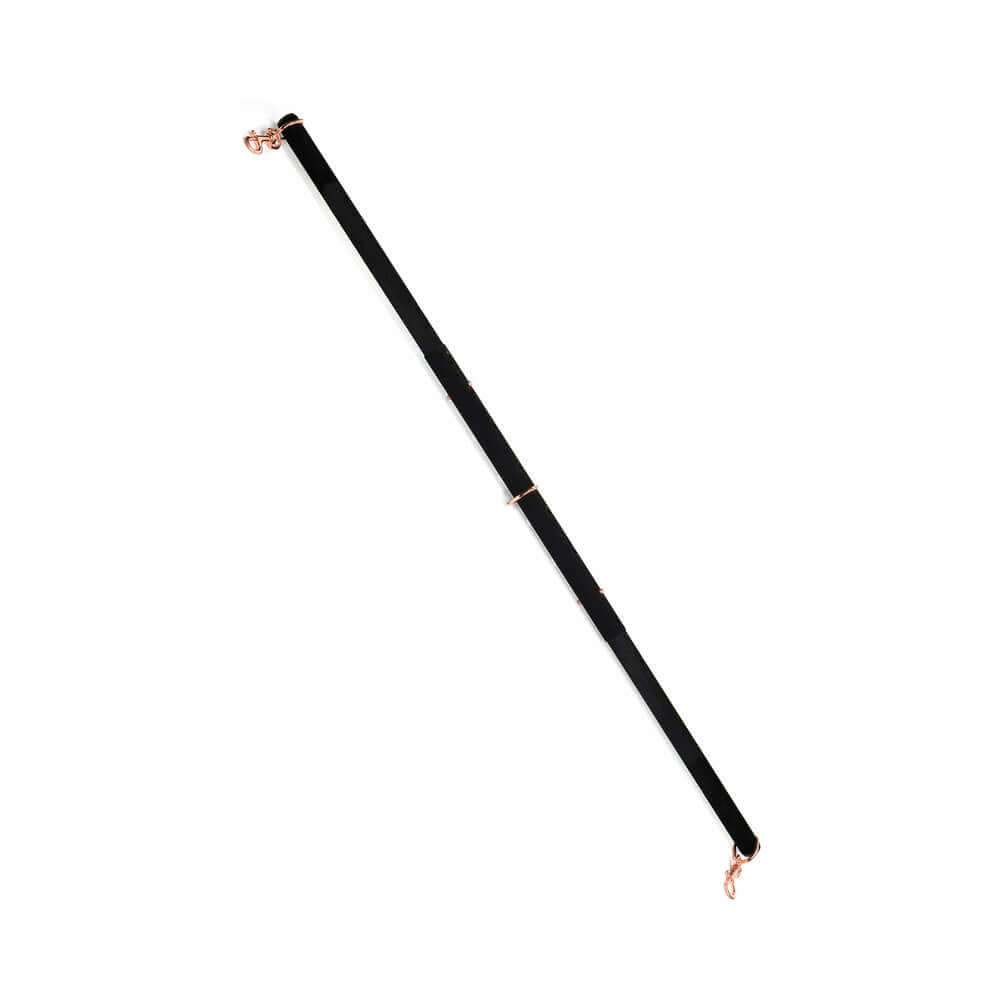 Coquette Pleasure Spreader Bar Black featuring a velvet finish and metal accents for bondage play.