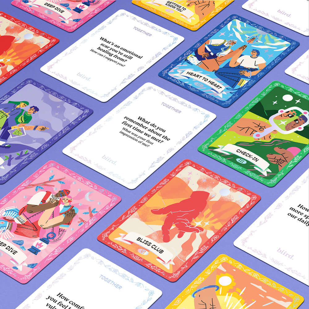 Colorful cards from the Biird x Jouissance Club Together Couples Card Game showcasing conversation prompts and activities.