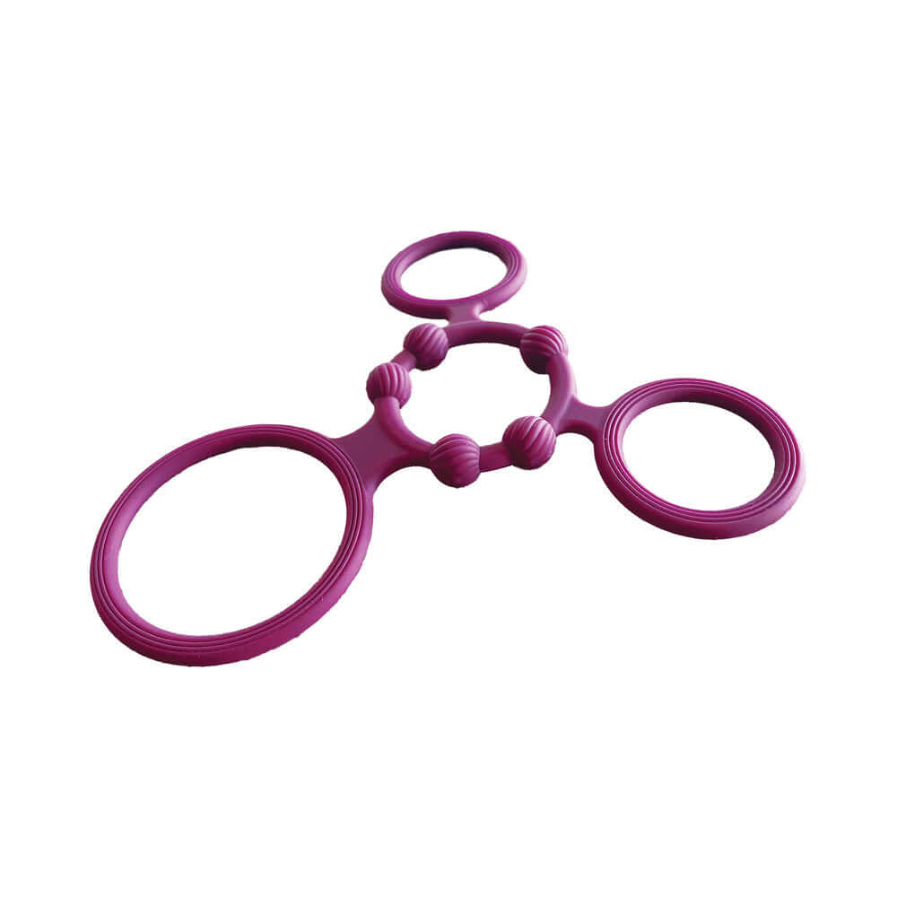 Enhancer Quad Cockring Rubine Red set of four stretchy reusable rings for enhanced pleasure.