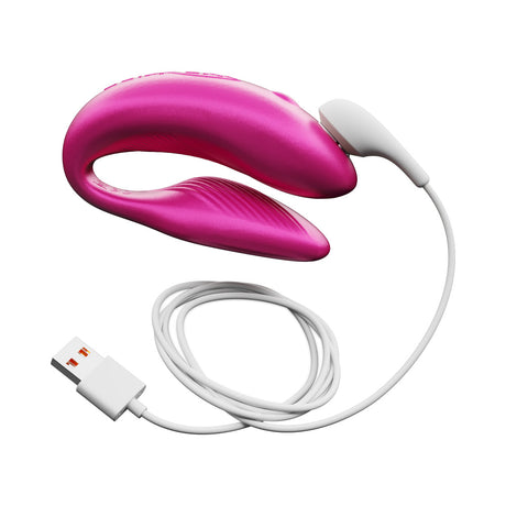 We-Vibe Chorus Couples Vibrator Cosmic Pink with USB charging cable, designed for shared intimacy and customizable pleasure.