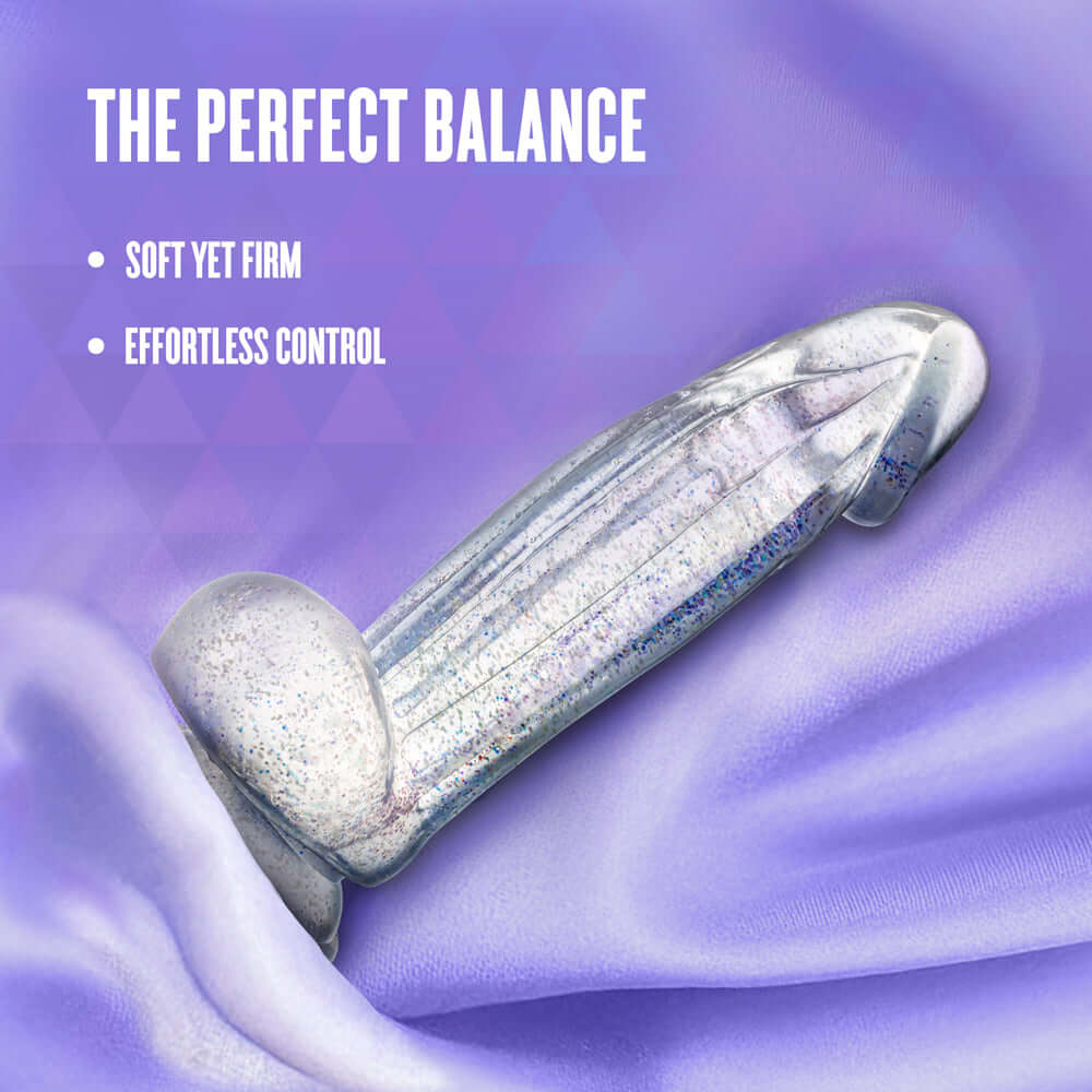 Naturally Yours Bling Sparkling Dildo Clear on soft purple fabric showcasing its perfect balance and shimmering design.