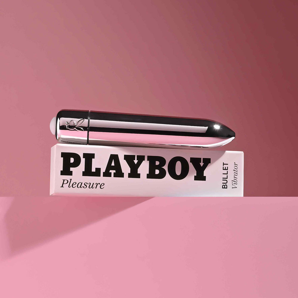 Playboy Pleasures 70th Anniversary Bullet on a pink background, showcasing its sleek design and powerful performance.