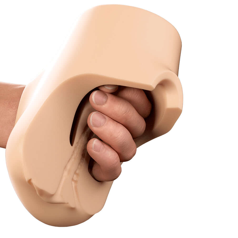 PDX Plus Double Pounder Vibrating Squeeze Stroker Light held in a hand demonstrating its design and grip functionality.