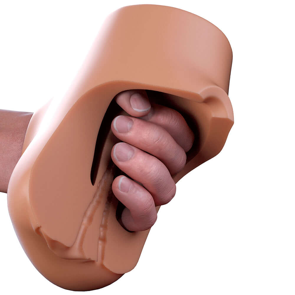 PDX Plus Double Pounder Vibrating Squeeze Stroker Brown held in hand for a personalized stimulation experience.