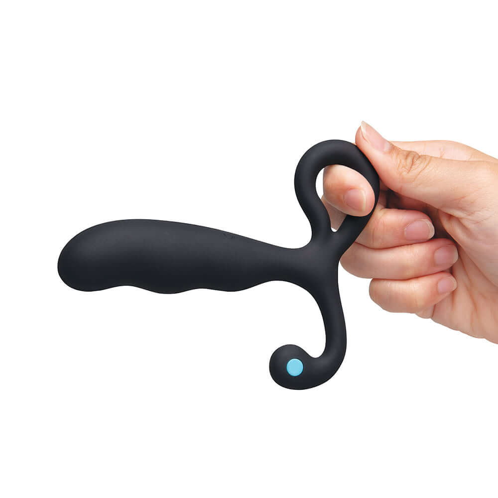 A person holding the b-Vibe P-Spot Vibing Prostate Massager with ergonomic design and customizable features.