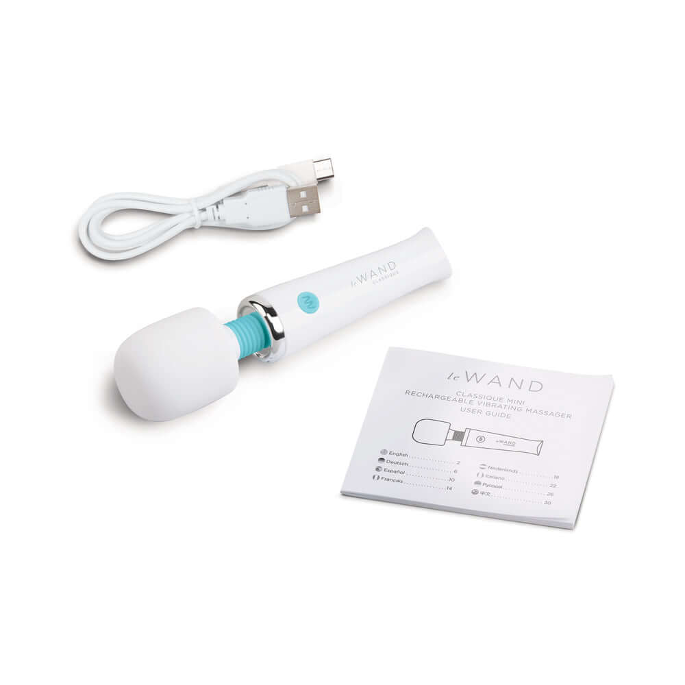 Le Wand Classique Mini Wand Massager with USB cable and instruction manual, compact design for travel.