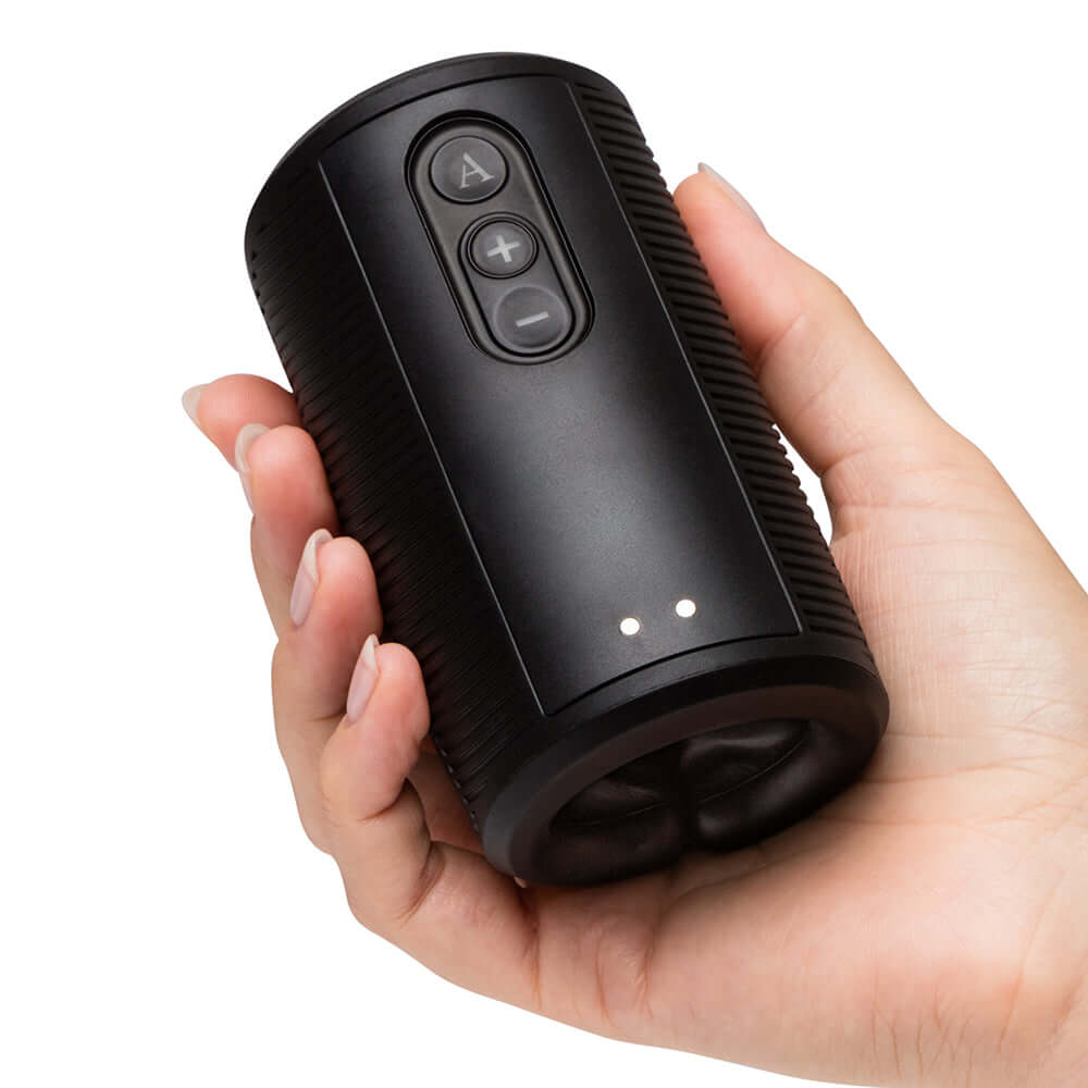 Hand holding the Arcwave Zing Vibrating Half Sleeve Dual Motor Masturbator, showcasing its sleek design and controls.