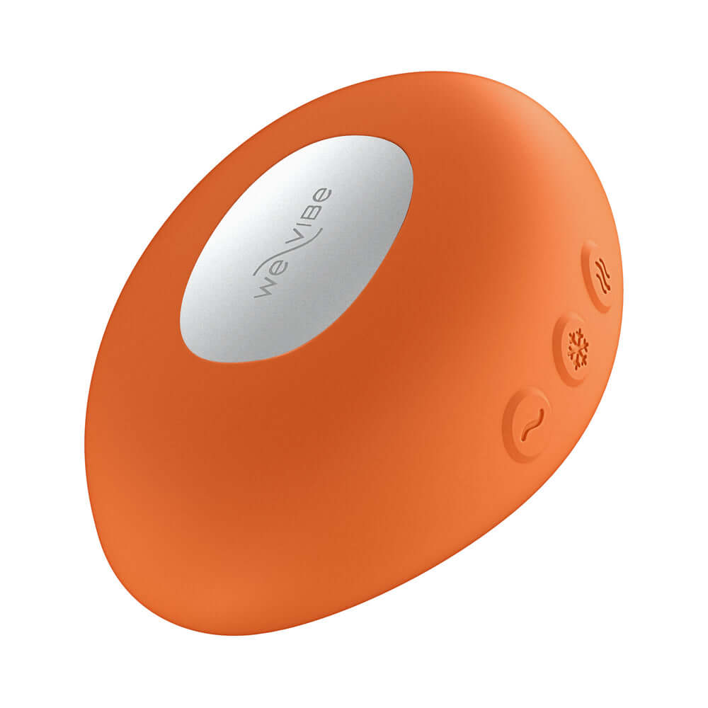 We-Vibe Temp Clitoral Massager Tangerine showing ergonomic design and temperature control features.