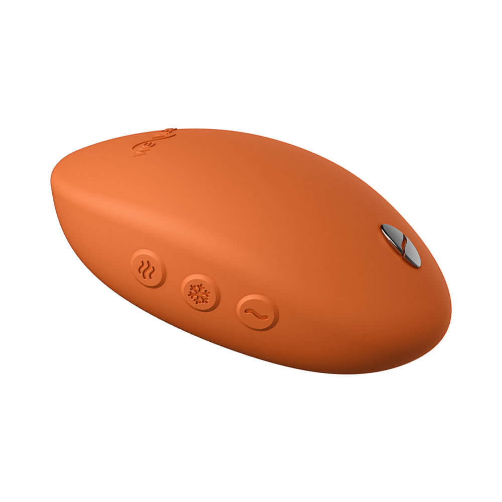 We-Vibe Temp Clitoral Massager Tangerine featuring ergonomic design and customizable heating and cooling settings.