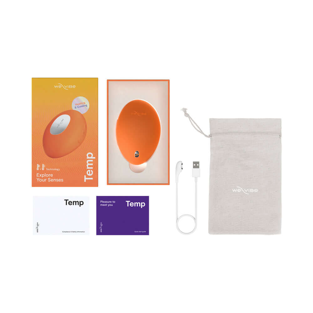 We-Vibe Temp Clitoral Massager Tangerine packaging and accessories including manual and charging cable.