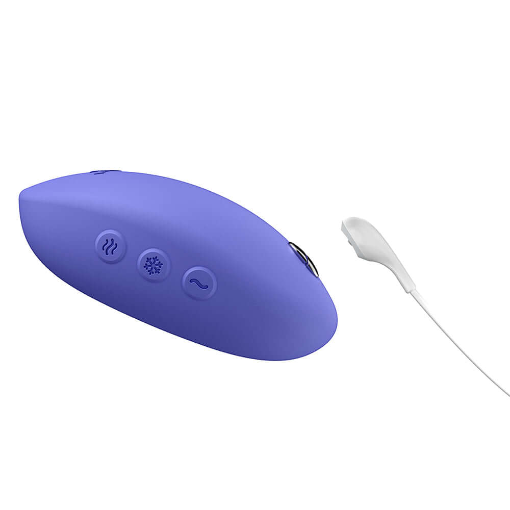 We-Vibe Temp Clitoral Massager Lavender Blue with buttons for temperature control and charging cable.