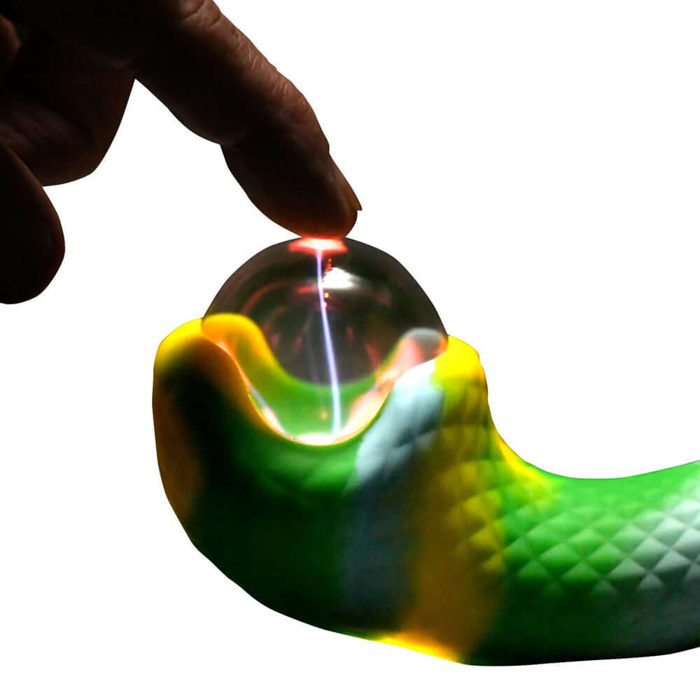 Close-up of the Creature Cocks Electric Eye Plasma Vibrator with a hand touching the spherical end.