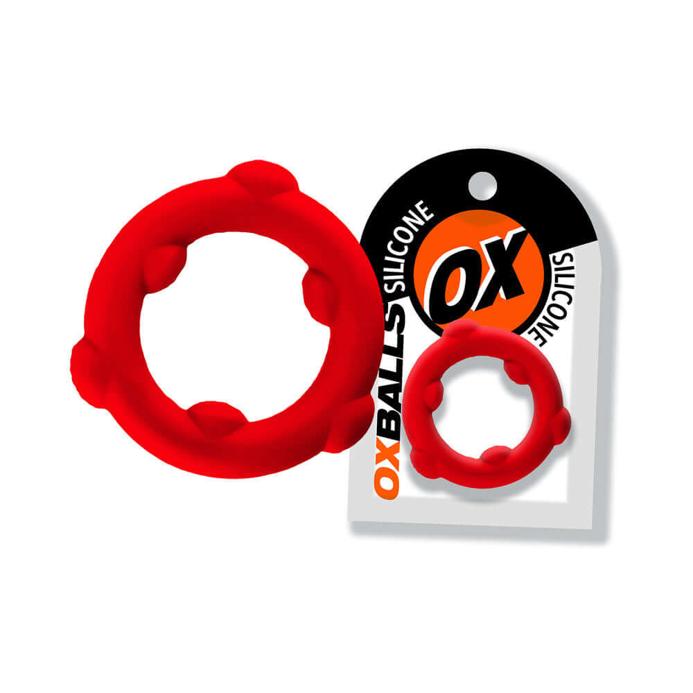 Oxballs Spinner Single Silicone Ring Red with packaging, showcasing its durable and flexible design.