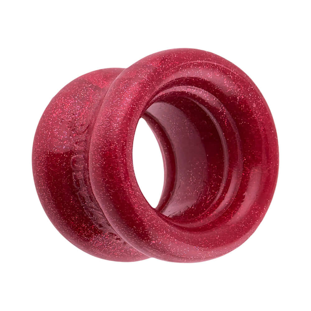 Oxballs Squeeze Short Ballstretcher Cherry Lips in red, showcasing a compact, hourglass shape for a secure fit.