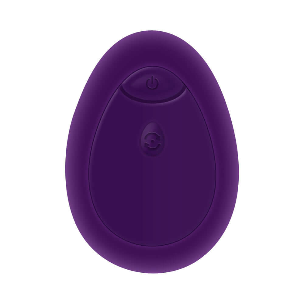 Playboy Pleasure This and That Double End Massager Acai purple silicone massager with control button on smooth surface.