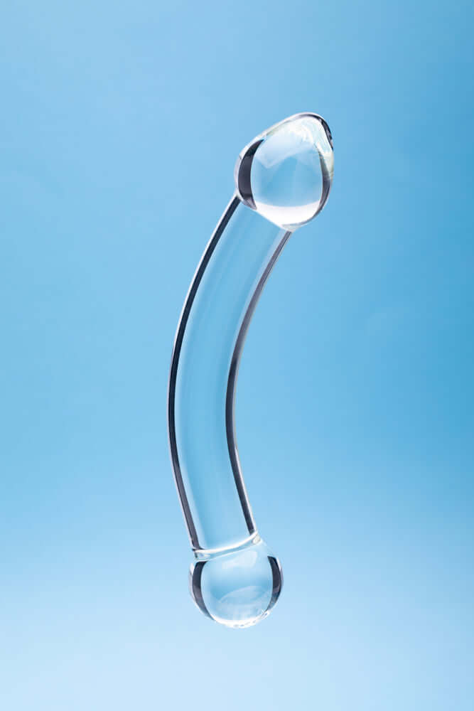 Clarity Celestial Purity Glass Dildo showcased against a light blue background, highlighting its elegant design.