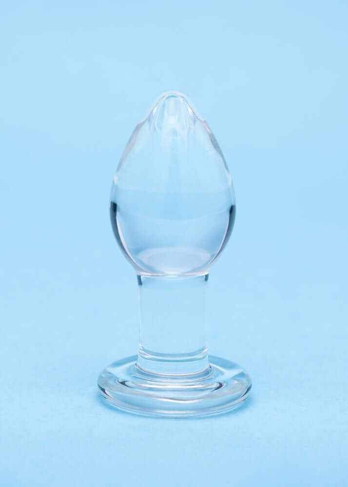 Clarity Utopian Trinity Glass Plug Set - a premium borosilicate glass butt plug on a blue background.