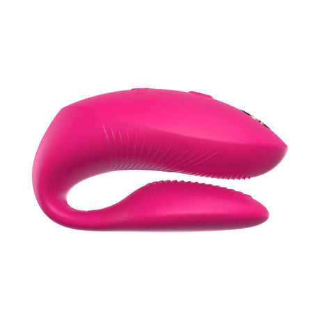 We-Vibe Chorus Pro Couples Massager Electric Pink side view showcasing ergonomic design and vibrant color.
