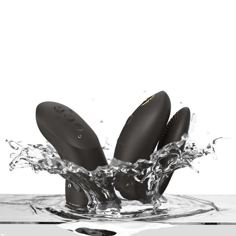 We-Vibe Chorus Couples Vibrator with Remote Control Black splashing in water for enhanced pleasure.