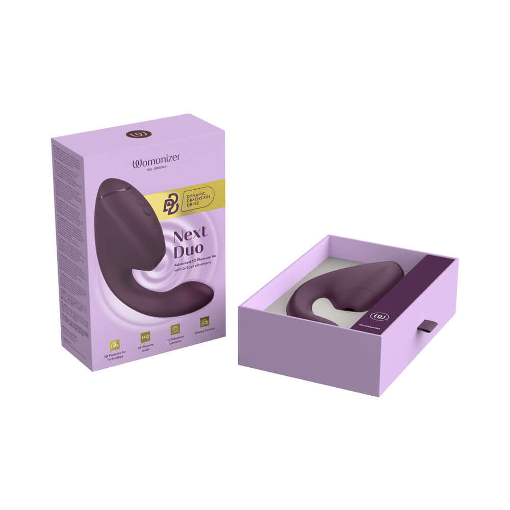 Womanizer Next Duo Massager Dark Purple in packaging, showcasing the luxurious design of the dual stimulator.