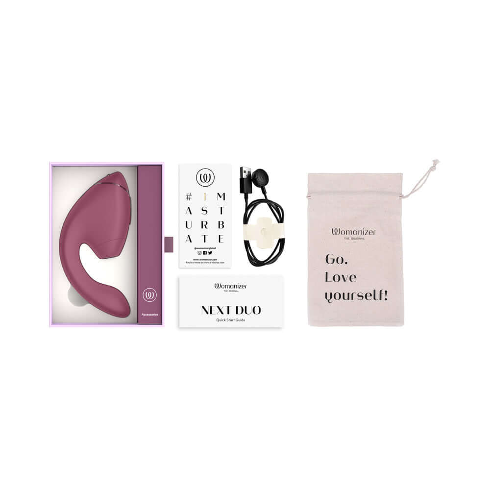 Womanizer Next Duo Massager Dusky Pink in packaging with accessories and care instructions.