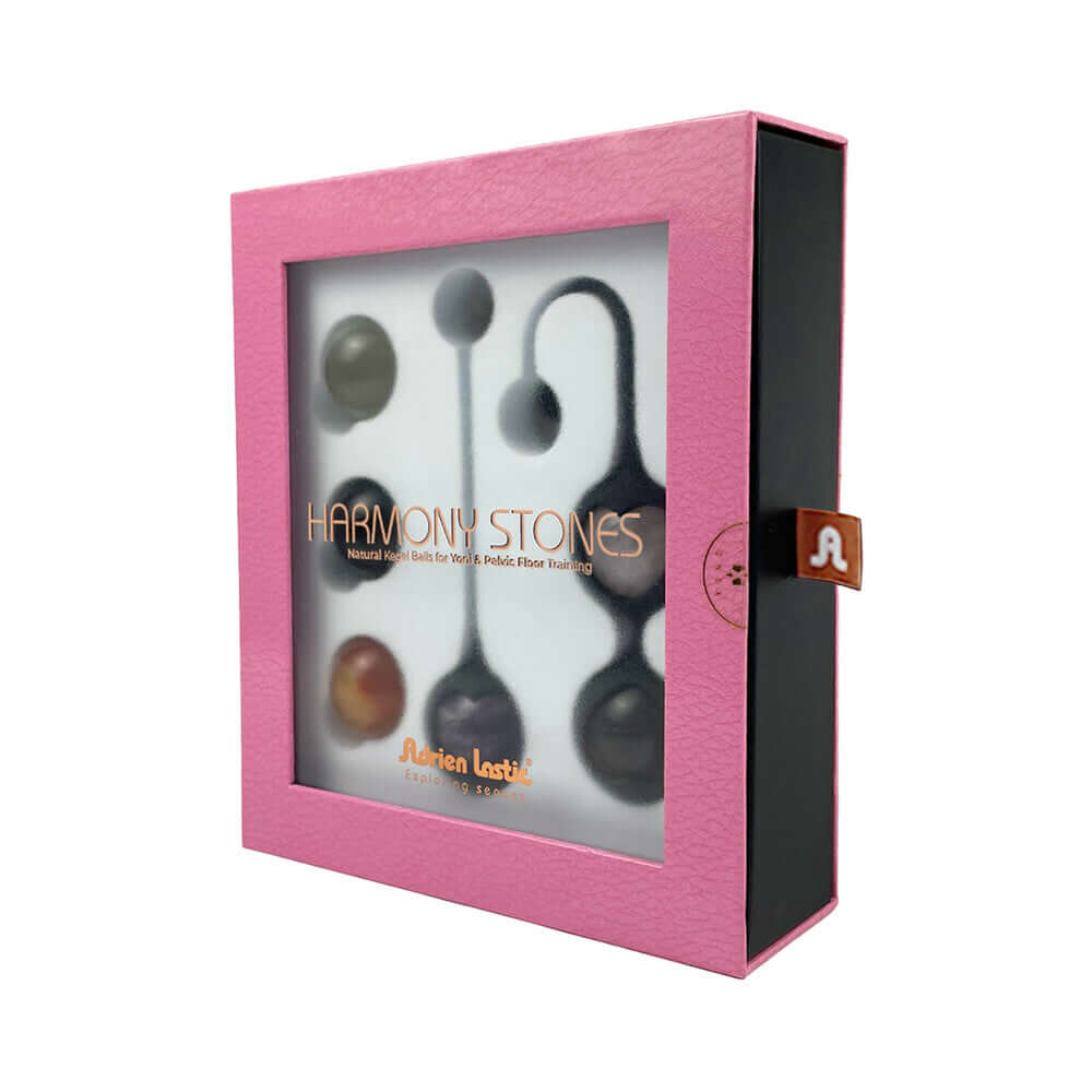 Adrien Lastic Harmony Stones Kegel and Chakra Set in a pink box showcasing natural stones for intimate wellness.