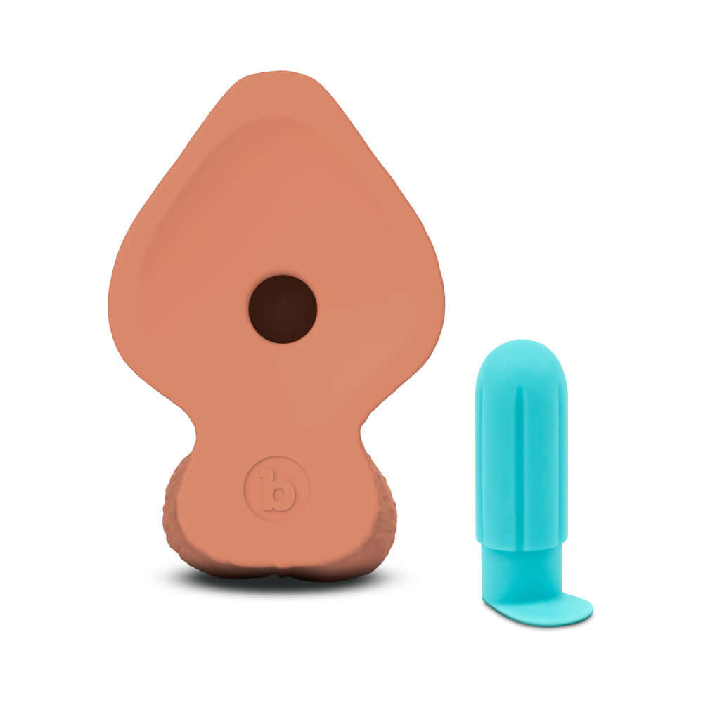 b-Vibe Slipskin Realistic Silicone Dildo 8 inch Girthy Mocha next to a blue stimulation device.