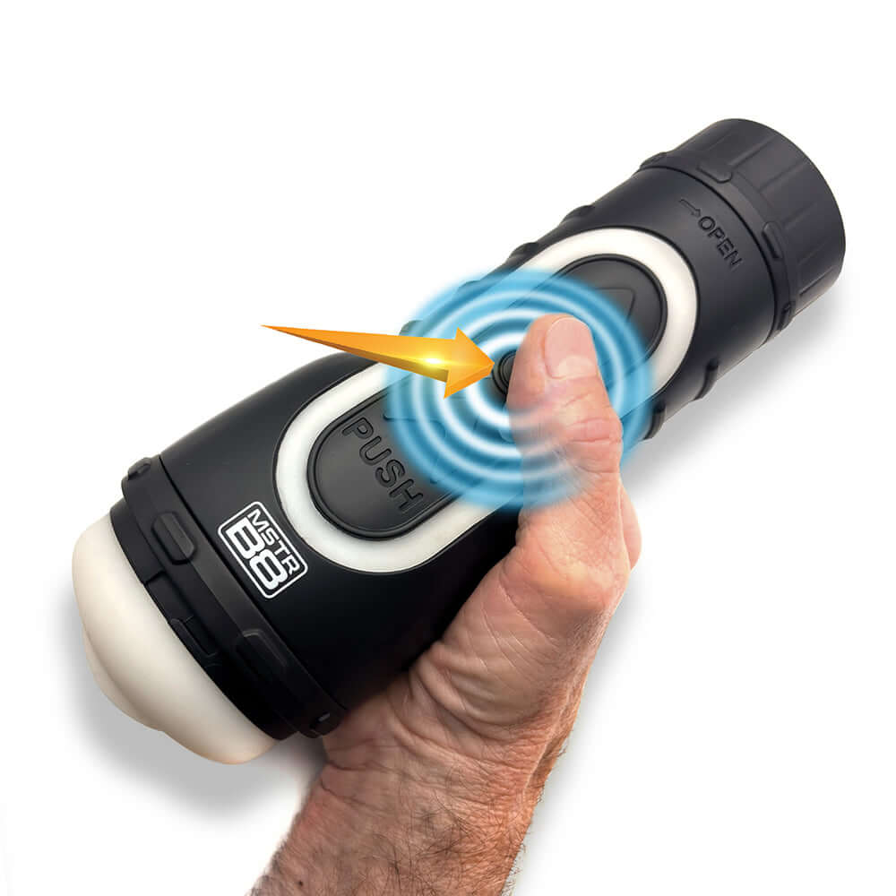 MSTR B8 Goon & Grip Vibrating Pressure Play Stroker being activated by hand for pleasurable experience.