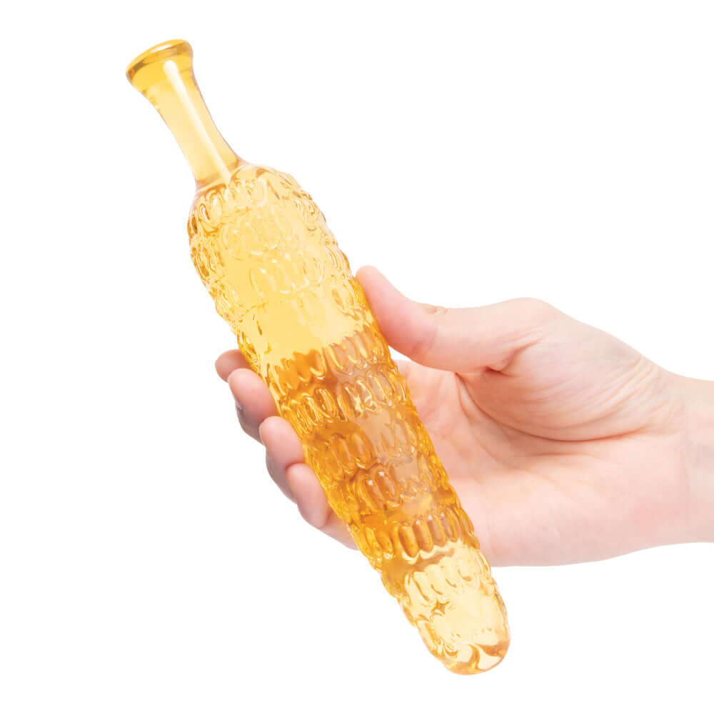 Hand holding the Glas Cornstar 8 inches Glass Dildo with a playful corn-on-the-cob design and textured surface.