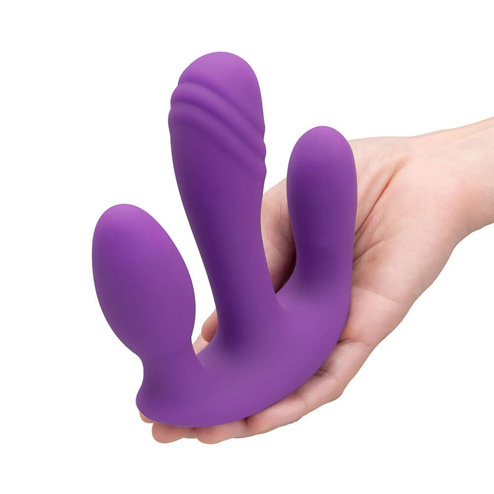 Together Blended Pleasure Remote Controlled Triple-Pronged Vibrator in hand for intimate stimulation.